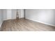 Well-lit bedroom with hardwood floors and access to bathroom at 3465 S Poplar St # 308, Denver, CO 80224