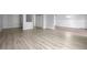 Bright living room features hardwood floors and an open floor plan at 3465 S Poplar St # 308, Denver, CO 80224
