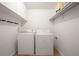 Bright laundry room with washer and dryer included at 3465 S Poplar St # 308, Denver, CO 80224