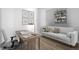 Cozy home office with built-in shelving and a comfortable sofa at 3465 S Poplar St # 308, Denver, CO 80224