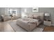 Main bedroom with plush bed and sitting area at 3465 S Poplar St # 308, Denver, CO 80224