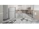 Kitchen with white cabinets, granite countertops, and stainless steel appliances at 3465 S Poplar St # 308, Denver, CO 80224