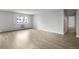 Spacious living room with hardwood floors and a view at 3465 S Poplar St # 308, Denver, CO 80224