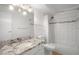 Bathroom with tub, shower, and granite countertop at 3465 S Poplar St # 308, Denver, CO 80224