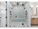 Large walk-in shower with dual shower heads and built-in bench at 930 S Clayton Way, Denver, CO 80209