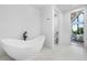 Bathroom with freestanding soaking tub and separate toilet area at 930 S Clayton Way, Denver, CO 80209