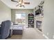 Cozy Gathering room with fireplace and built-in shelving at 11533 Dahlia St, Thornton, CO 80233