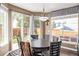 Bright dining area with backyard access and table for six at 11533 Dahlia St, Thornton, CO 80233