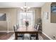Bright dining room with a large table and hardwood floors at 11533 Dahlia St, Thornton, CO 80233