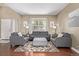 Cozy living room featuring hardwood floors and comfortable seating at 11533 Dahlia St, Thornton, CO 80233