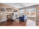 Gathering room with fireplace, hardwood floors, and access to backyard at 11533 Dahlia St, Thornton, CO 80233