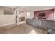 Basement recreation area with sectional sofa and wet bar at 11533 Dahlia St, Thornton, CO 80233