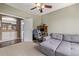 Home office with built-in shelving and access to other rooms at 11533 Dahlia St, Thornton, CO 80233