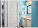 Light blue bathroom with granite countertop, white cabinets, and a sink at 11533 Dahlia St, Thornton, CO 80233