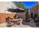 Backyard patio with table, chairs, and umbrella at 11533 Dahlia St, Thornton, CO 80233