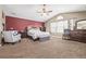 Large main bedroom with carpeted floors, ceiling fan, and ensuite bathroom at 11533 Dahlia St, Thornton, CO 80233