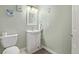 Small bathroom with white vanity and toilet at 11533 Dahlia St, Thornton, CO 80233