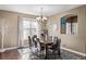 Elegant dining room featuring a large table and hardwood floors at 11533 Dahlia St, Thornton, CO 80233