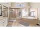 Bathroom with soaking tub, shower, and granite countertops at 11533 Dahlia St, Thornton, CO 80233