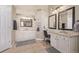 Double vanity bathroom with granite countertops and ample storage at 11533 Dahlia St, Thornton, CO 80233