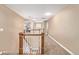 Spacious loft area overlooking the main level with carpeted floors at 11533 Dahlia St, Thornton, CO 80233
