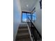 Modern staircase with metal railing leading to upper level at 1254 Yates St, Denver, CO 80204