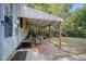 Covered back patio with seating, a grill, and a fenced backyard at 3230 S Ogden St, Englewood, CO 80113