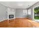 Living room featuring hardwood floors, fireplace and sliding glass doors at 19058 E Bonney Ct, Parker, CO 80134