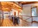 Gourmet kitchen with wood beams, large island, and hardwood floors at 537 Moonstone Rd, Breckenridge, CO 80424