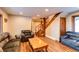 Living area with hardwood floors and staircase at 537 Moonstone Rd, Breckenridge, CO 80424