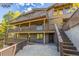 Exterior view of a multi-level home with a staircase at 537 Moonstone Rd, Breckenridge, CO 80424