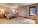 Spacious bedroom with rustic bed frame and mountain views at 537 Moonstone Rd, Breckenridge, CO 80424