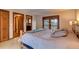 King sized bed with access to private bathroom and balcony at 537 Moonstone Rd, Breckenridge, CO 80424