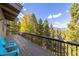 Relaxing deck with mountain views and blue chairs at 537 Moonstone Rd, Breckenridge, CO 80424