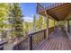 Multi-level deck with wooden railings and mountain views at 537 Moonstone Rd, Breckenridge, CO 80424