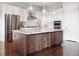 Stylish kitchen with granite countertops, stainless steel appliances, and a wooden island at 22980 E Del Norte Cir, Aurora, CO 80016