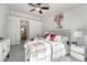 Main bedroom with large window, ceiling fan, and ample space at 466 Black Feather Loop # 510, Castle Rock, CO 80104