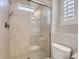 Bathroom with walk-in shower and neutral tile at 2514 Sweet Wind Ave, Castle Rock, CO 80109