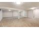 Finished basement offering ample living space and neutral tones at 5001 E Iliff Ave, Denver, CO 80222