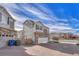 Townhouse exterior with gray siding, brick accents, and driveway at 224 S Old Hammer St, Aurora, CO 80018