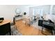 Modern dining area with hardwood floors and a view of the living room at 2180 S Logan St, Denver, CO 80210