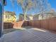 Private backyard with wooden deck and fenced-in area at 7816 Elmwood St, Littleton, CO 80125