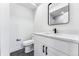 Modern bathroom with vanity, toilet and shower at 1420 Pierce St, Lakewood, CO 80214