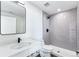 Clean bathroom with shower and white vanity at 1420 Pierce St, Lakewood, CO 80214