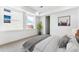 Spacious bedroom with large window, plush bed, and neutral color palette at 1420 Pierce St, Lakewood, CO 80214