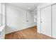 Simple bedroom with wood floor and closet at 1420 Pierce St, Lakewood, CO 80214
