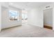 Spacious bedroom with plush carpeting and city views at 1420 Pierce St, Lakewood, CO 80214