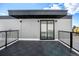 Private rooftop deck with modern tile flooring at 1420 Pierce St, Lakewood, CO 80214