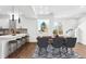 Open concept dining area with kitchen and bar seating at 1420 Pierce St, Lakewood, CO 80214