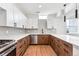 Modern kitchen with wood cabinets, white countertops, and stainless steel appliances at 1420 Pierce St, Lakewood, CO 80214